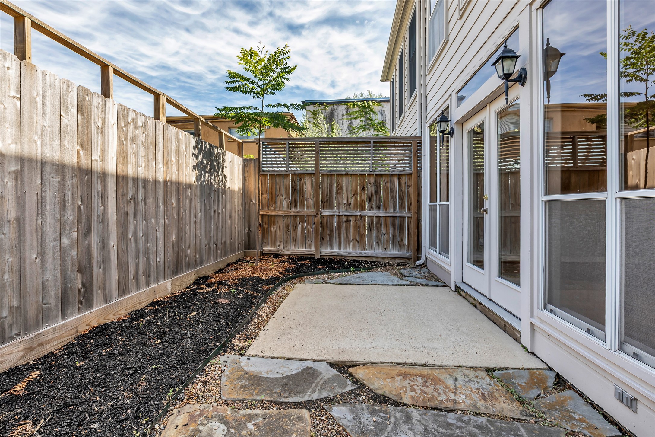 4916 Travis Street Houston, TX 77004 - Photo 23 of 27 a view of a brick house with wooden floor and a window