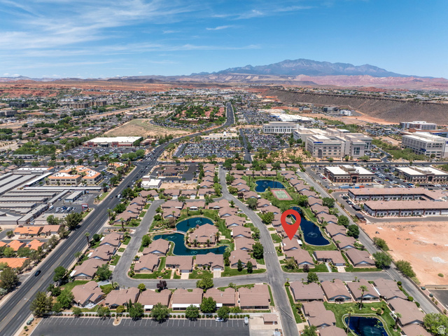805 South River Road, Unit 70 St. George, UT 84790 - Photo 37 of 38 Aerial perspective of a community with residential properties and commercial buildings