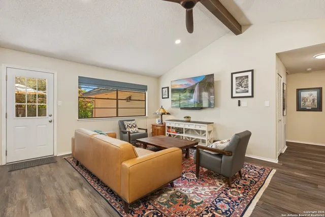 a living room with furniture and a window