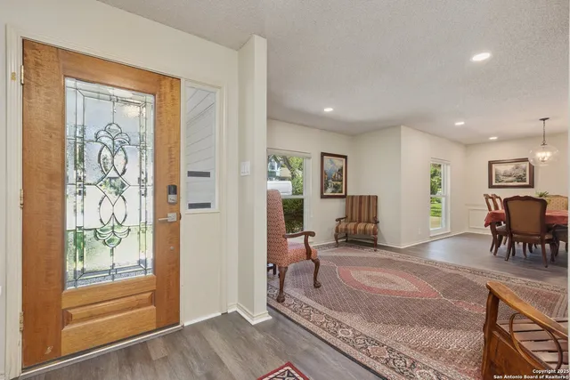 a living room with furniture and a table