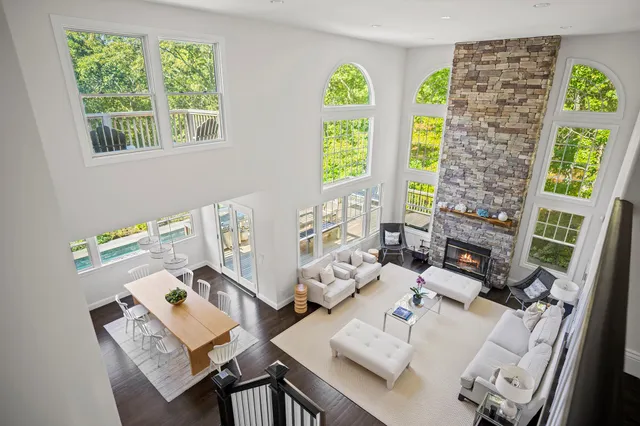 a living room with fireplace furniture and a window