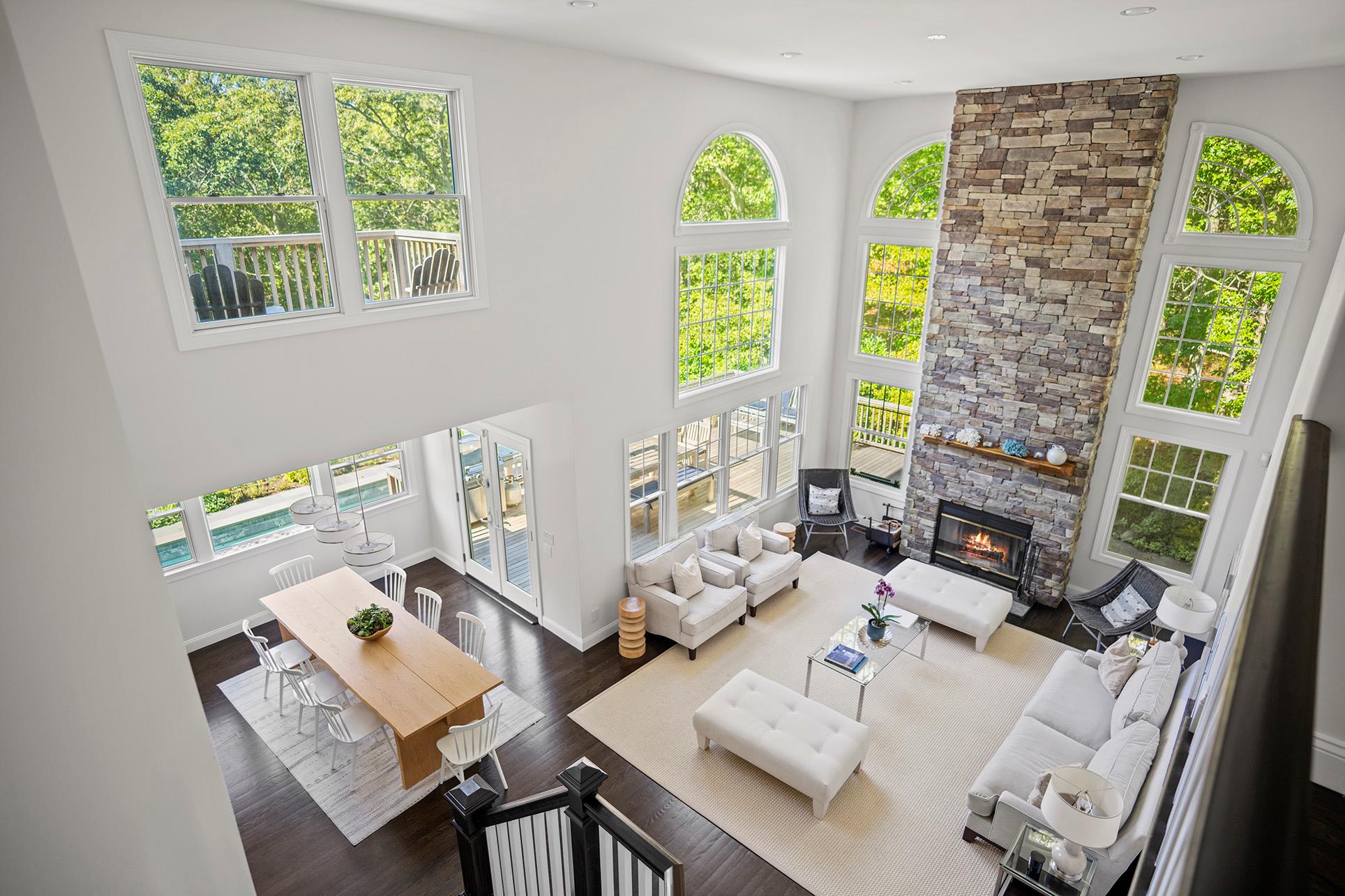a living room with fireplace furniture and a window