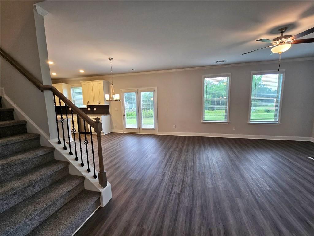 3856 Lockaby Way Lawrenceville, GA 30044 - Photo 14 of 36 an empty room with wooden floor and windows
