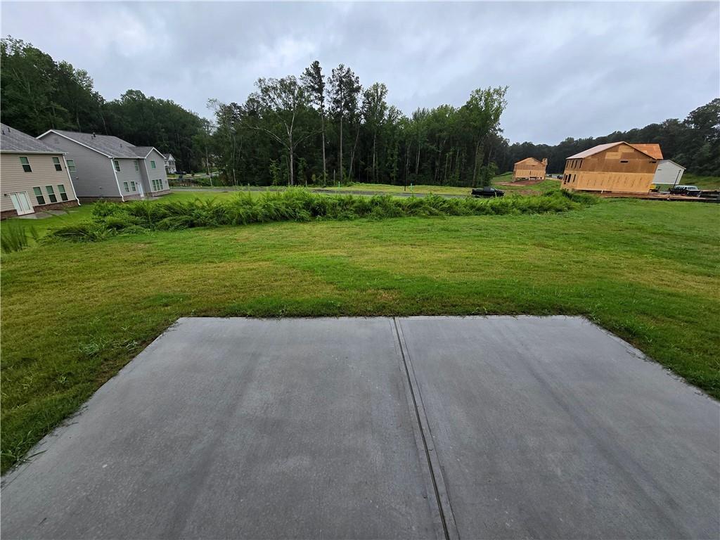 3856 Lockaby Way Lawrenceville, GA 30044 - Photo 23 of 36 a view of backyard with plants and trees
