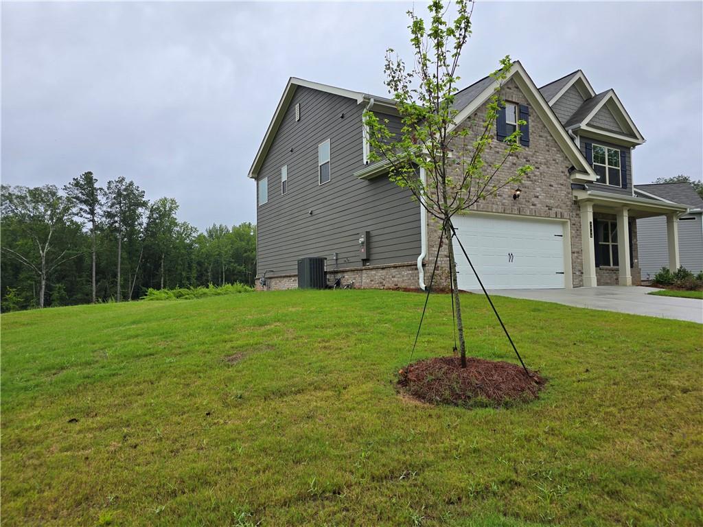 3856 Lockaby Way Lawrenceville, GA 30044 - Photo 3 of 36 a view of a house with a park