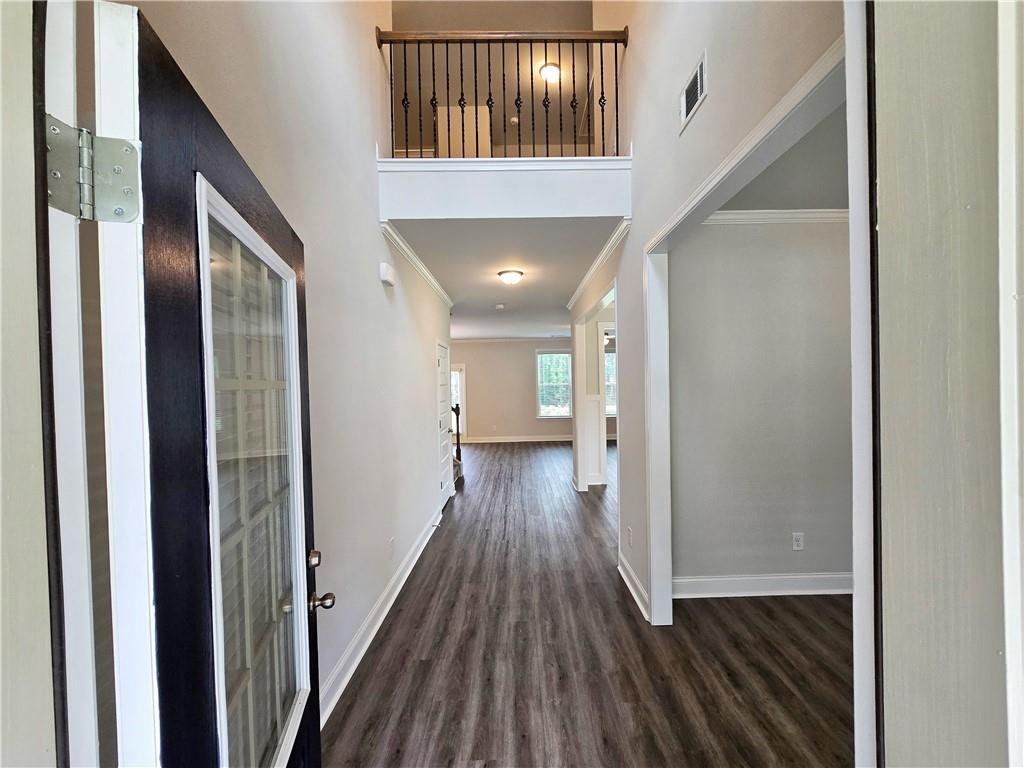 3856 Lockaby Way Lawrenceville, GA 30044 - Photo 5 of 36 a view of hallway with wooden floor
