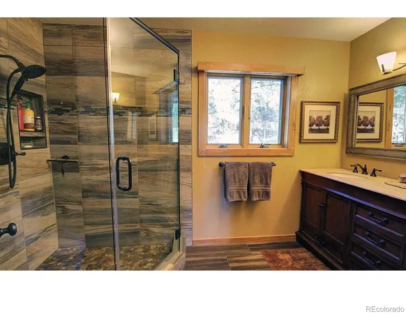 a bathroom with a sink a vanity and a mirror