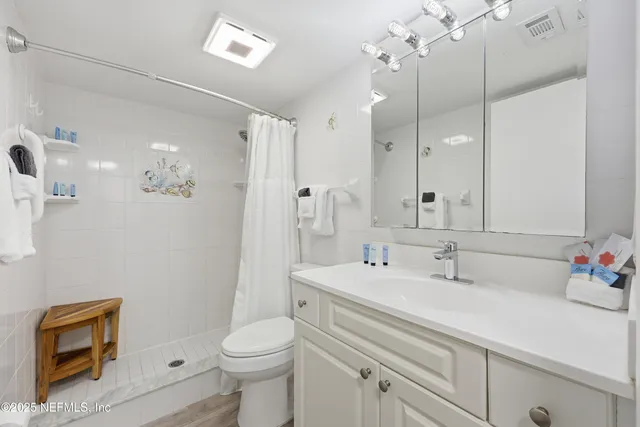 a bedroom with a large bed and a large window