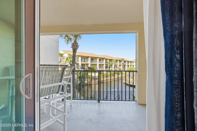 a view of a balcony with furniture