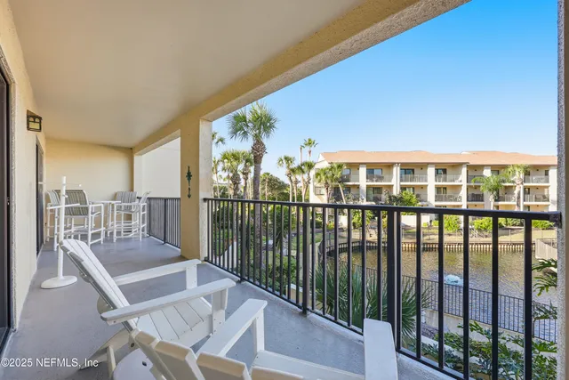 a view of balcony with furniture