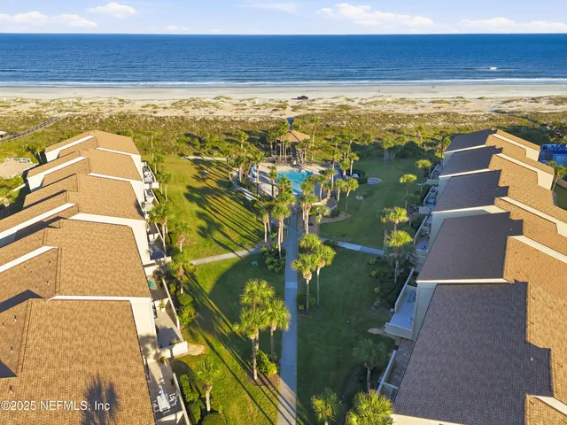 an aerial view of residential building with parking space