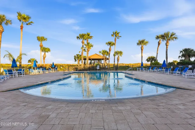 a view of swimming pool with outdoor seating