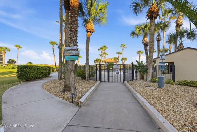 a view of a patio with a table and chairs
