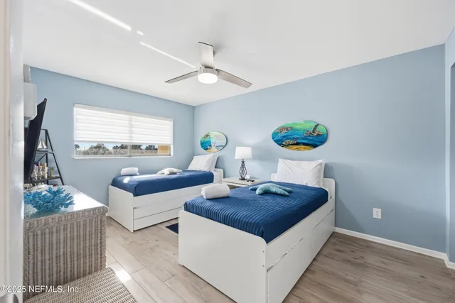 a living room with furniture and a lamp