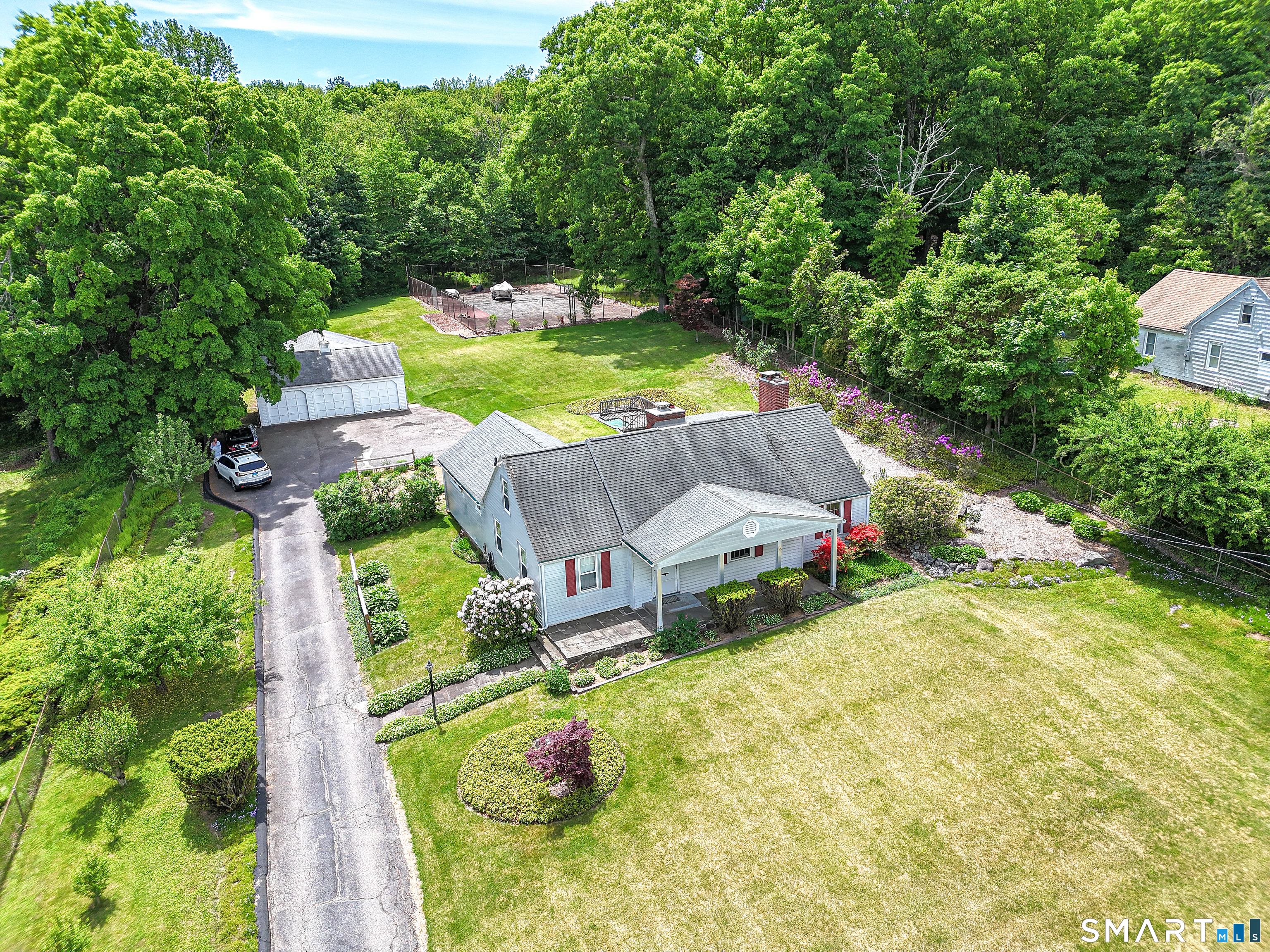 44 Summit Road Prospect, CT 06712 - Photo 36 of 40 an aerial view of a house with swimming pool and garden