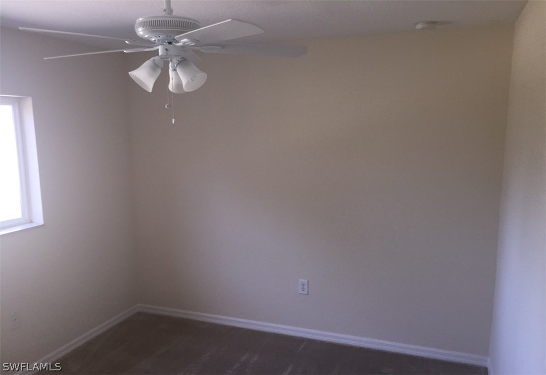 11890 Shawnee Road Fort Myers, FL 33913 - Photo 17 of 21 an empty room with a window