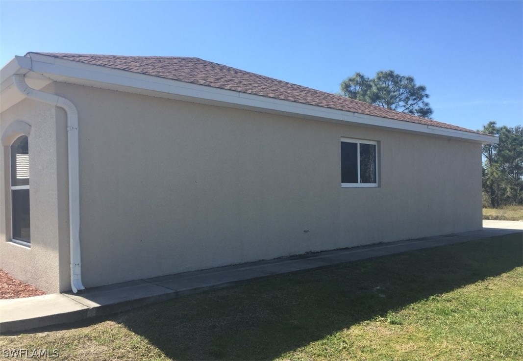 11890 Shawnee Road Fort Myers, FL 33913 - Photo 2 of 21 a view of a backyard of the house