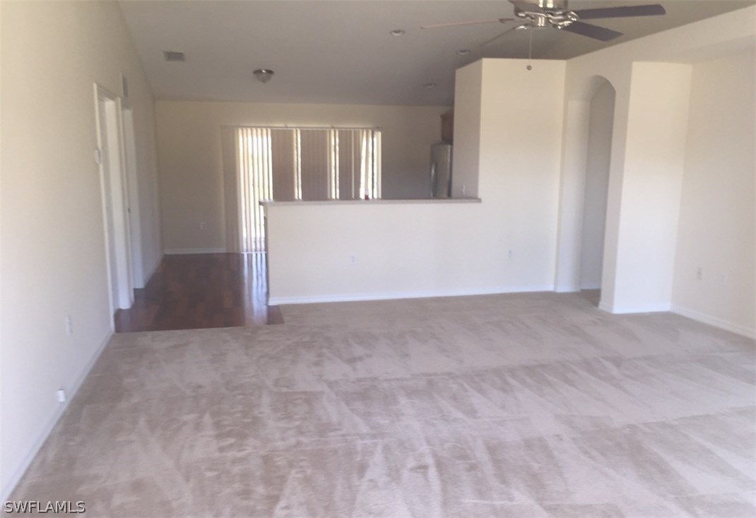 11890 Shawnee Road Fort Myers, FL 33913 - Photo 8 of 21 a view of a big room with windows and cabinet