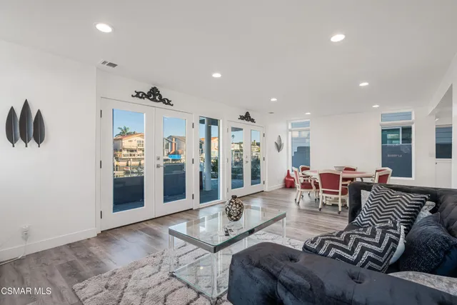 a bathroom with a double vanity sink mirror and toilet
