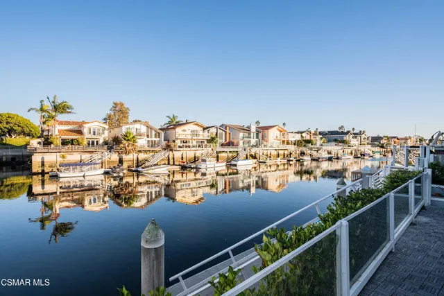 a picture of a room with a white wall and a large window