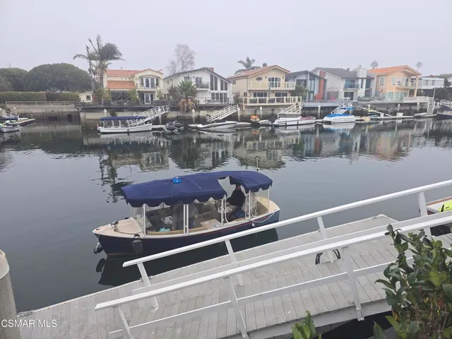 a picture of a room with a white wall and a large window