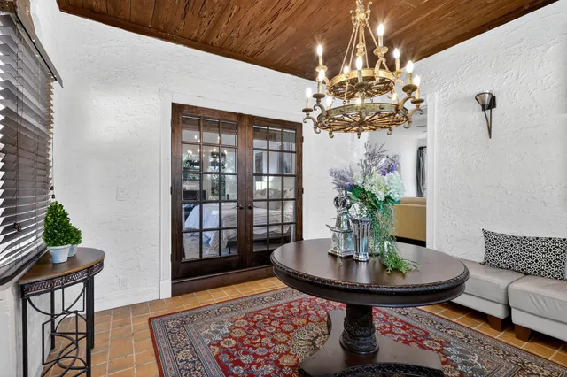 a bedroom with a large bed and a large window