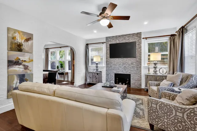 a bedroom with a large bed and a large window