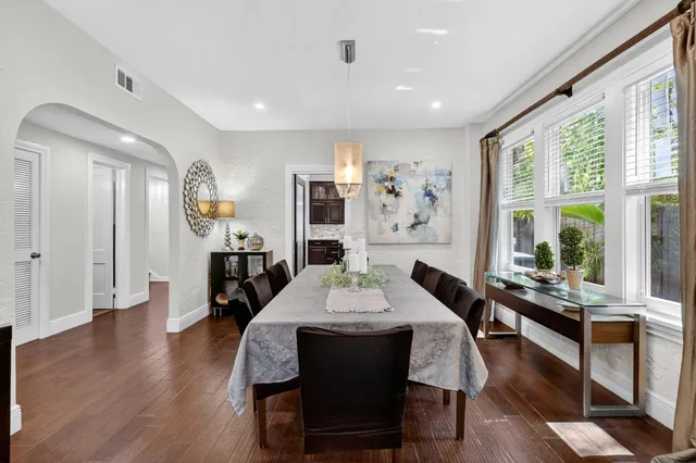 a room with stainless steel appliances granite countertop a refrigerator and a sink