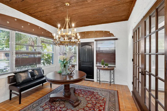 a kitchen with stainless steel appliances kitchen island granite countertop a refrigerator and a stove top oven