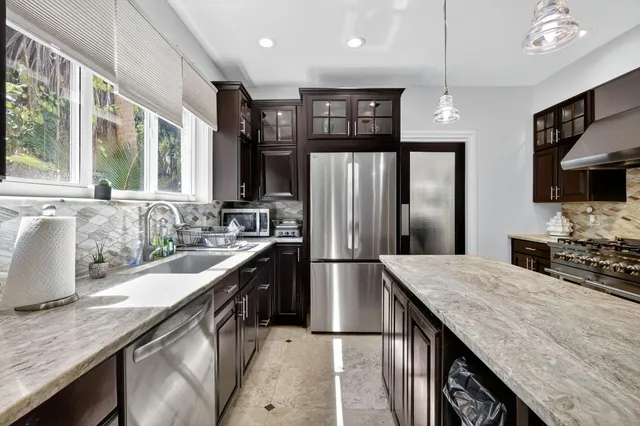 a living room with furniture or chandelier and a wooden floor