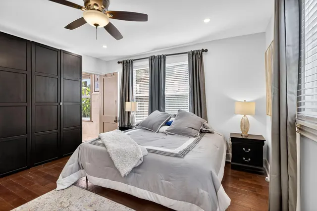 a bedroom with double bed and a chandelier