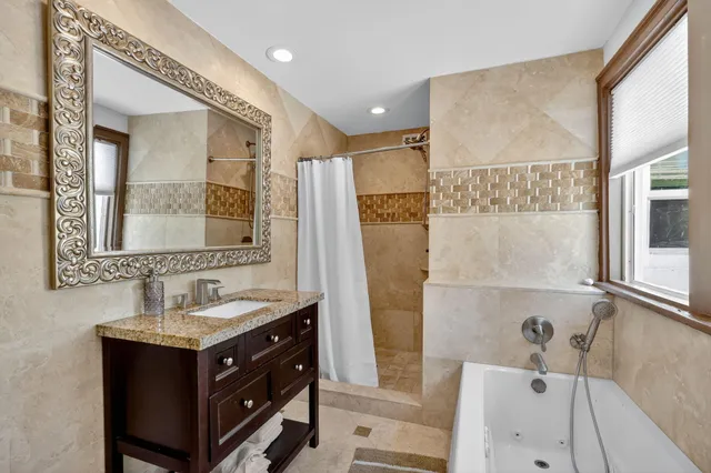 a view of a house with swimming pool and sitting area