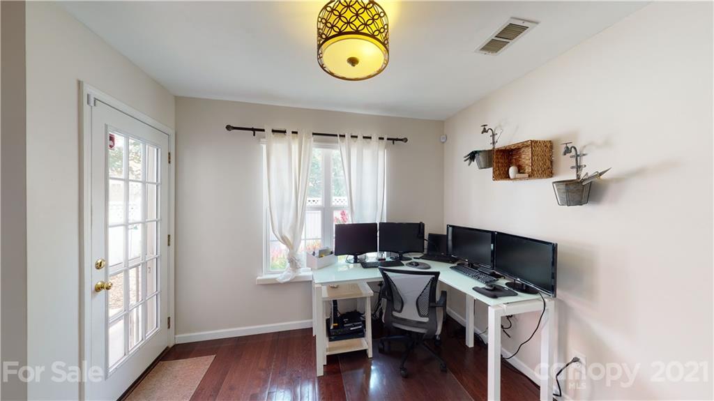11642 Rabbit Ridge Road Charlotte, NC 28270 - Photo 15 of 45 a view of workspace with wooden floor windows and furniture