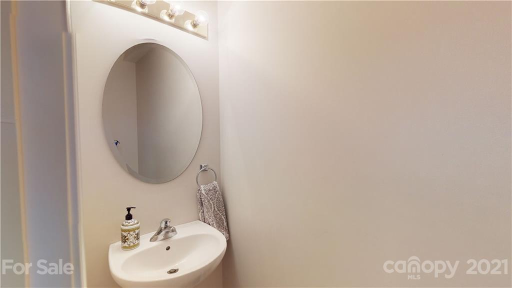11642 Rabbit Ridge Road Charlotte, NC 28270 - Photo 17 of 45 a bathroom with a sink and a mirror