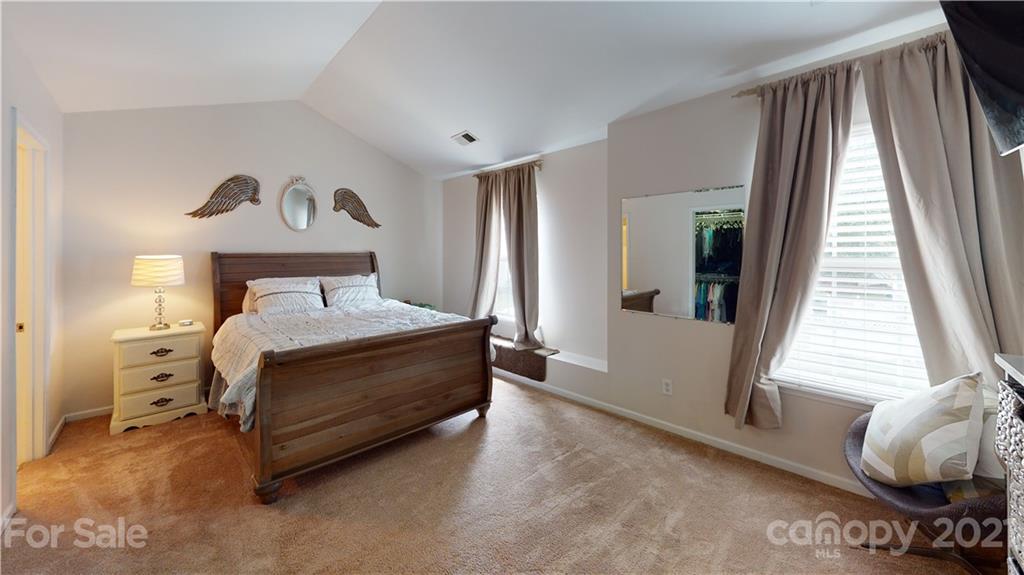 11642 Rabbit Ridge Road Charlotte, NC 28270 - Photo 18 of 45 a bedroom with a bed and a window