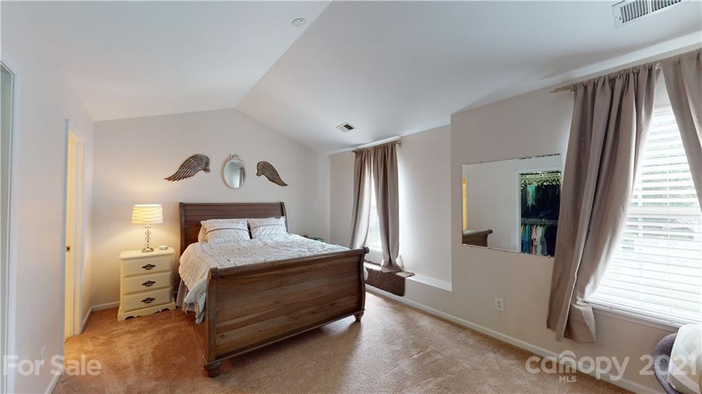 11642 Rabbit Ridge Road Charlotte, NC 28270 - Photo 19 of 45 a bedroom with a bed and window