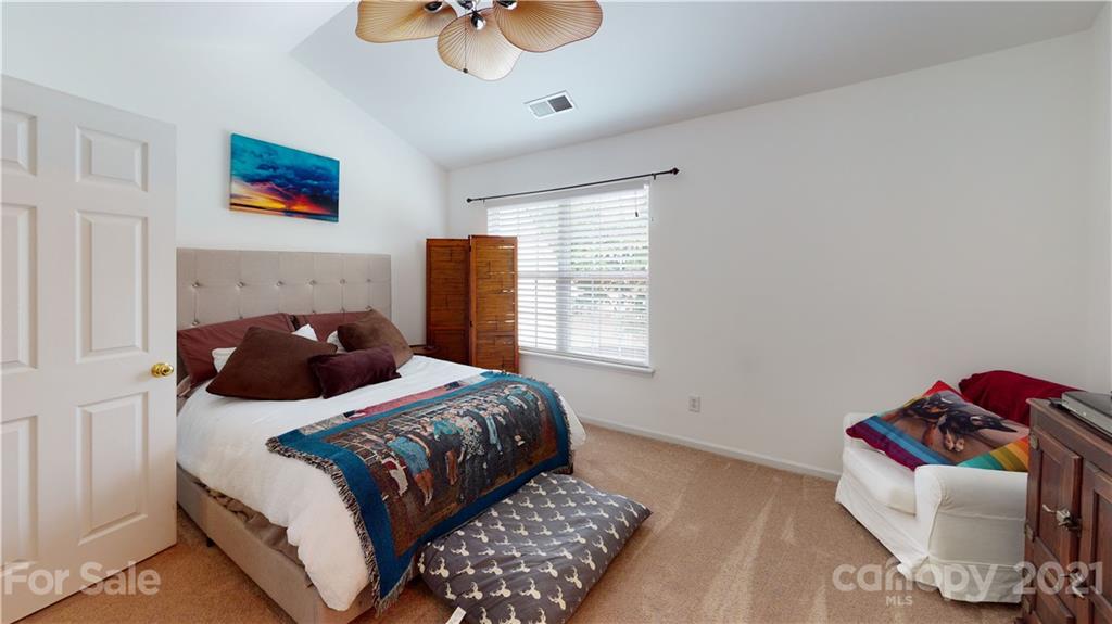11642 Rabbit Ridge Road Charlotte, NC 28270 - Photo 23 of 45 a bedroom with a bed and window