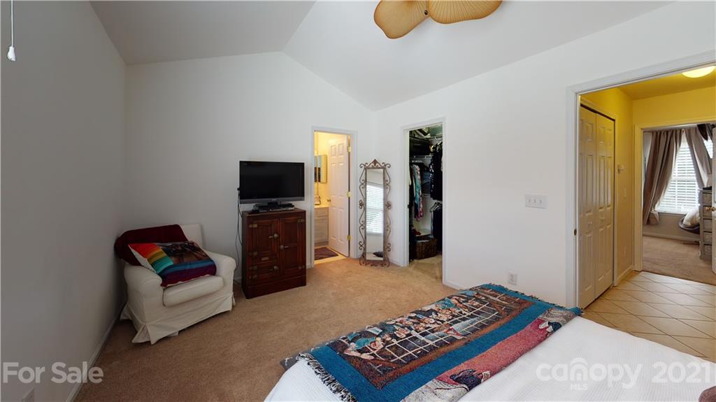 11642 Rabbit Ridge Road Charlotte, NC 28270 - Photo 24 of 45 a living room with furniture and a flat screen tv