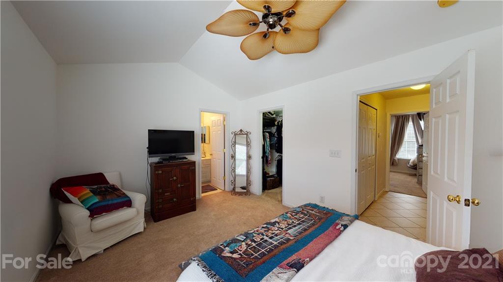 11642 Rabbit Ridge Road Charlotte, NC 28270 - Photo 25 of 45 a bedroom with a bed and wooden floor