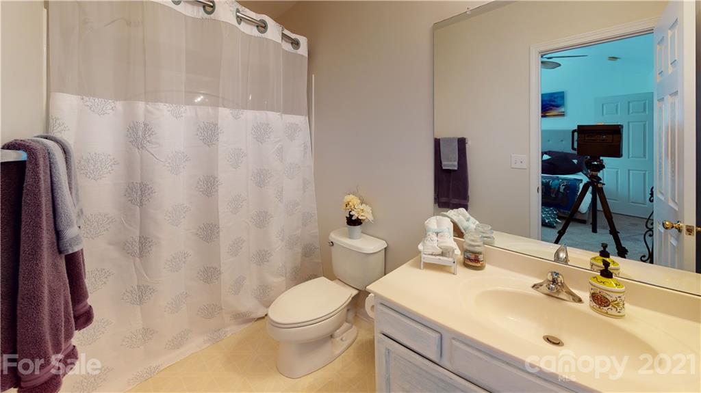 11642 Rabbit Ridge Road Charlotte, NC 28270 - Photo 28 of 45 a bathroom with a sink toilet and shower
