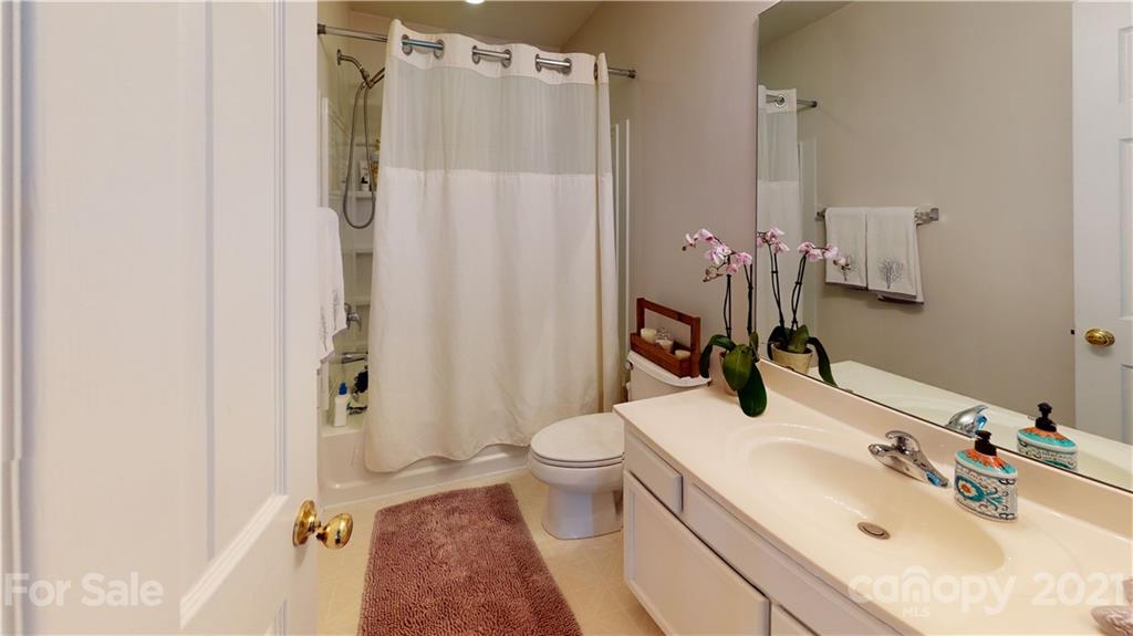 11642 Rabbit Ridge Road Charlotte, NC 28270 - Photo 29 of 45 a bathroom with a sink toilet and shower