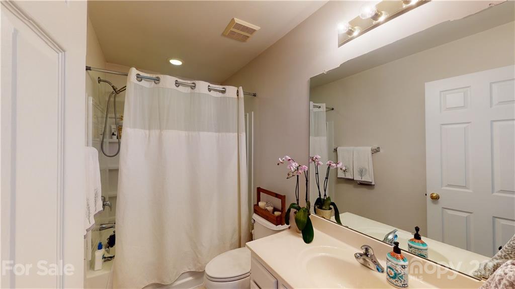 11642 Rabbit Ridge Road Charlotte, NC 28270 - Photo 32 of 45 a bathroom with a sink toilet and shower