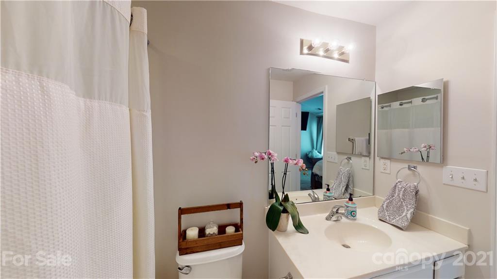 11642 Rabbit Ridge Road Charlotte, NC 28270 - Photo 33 of 45 a bathroom with a sink and a mirror