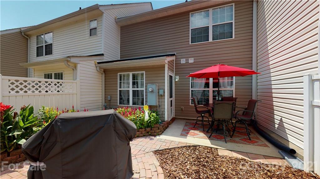 11642 Rabbit Ridge Road Charlotte, NC 28270 - Photo 36 of 45 a view of a house with chairs and a yard