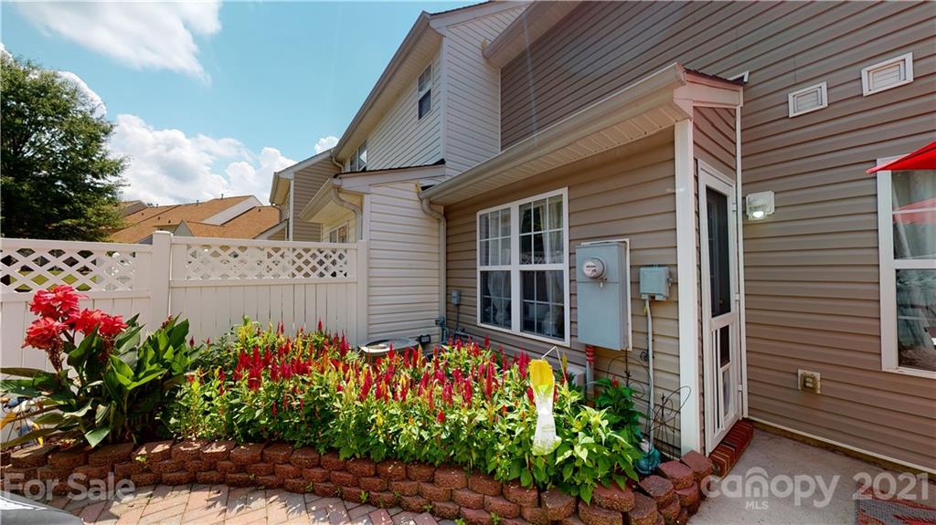 11642 Rabbit Ridge Road Charlotte, NC 28270 - Photo 42 of 45 a view of a house with a flower garden
