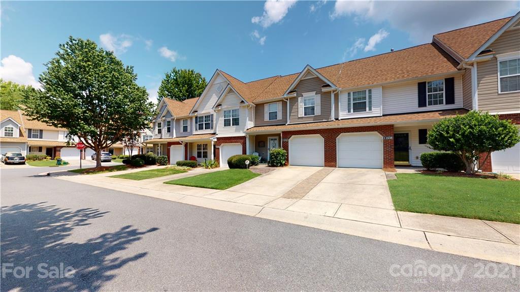 11642 Rabbit Ridge Road Charlotte, NC 28270 - Photo 43 of 45 a front view of a house with a yard and garage