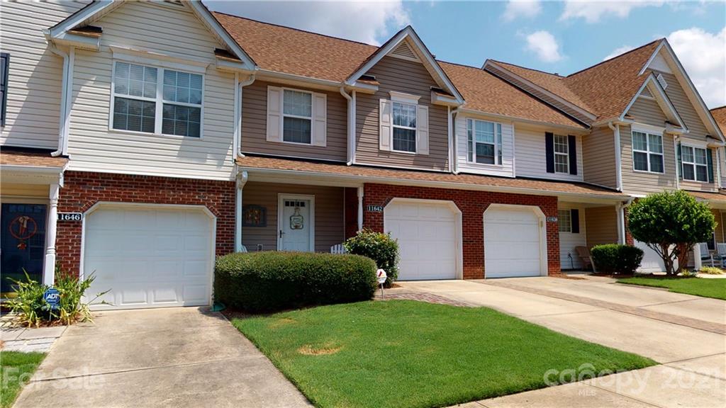 11642 Rabbit Ridge Road Charlotte, NC 28270 - Photo 44 of 45 a front view of a house with a yard and garage