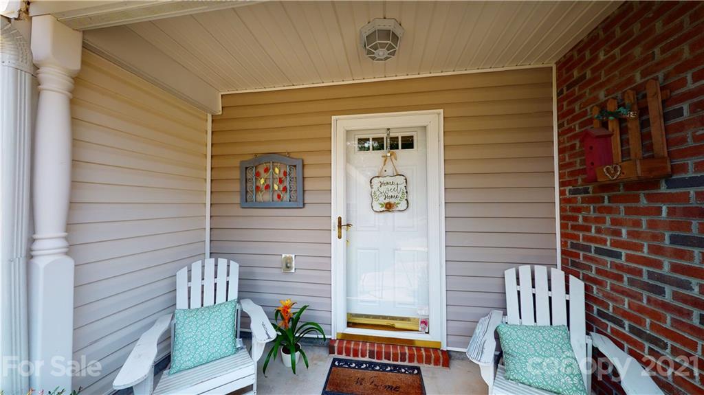 11642 Rabbit Ridge Road Charlotte, NC 28270 - Photo 7 of 45 a view of a door and chair in the balcony