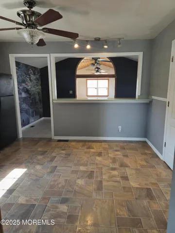 a kitchen with stainless steel appliances granite countertop a stove sink and cabinets