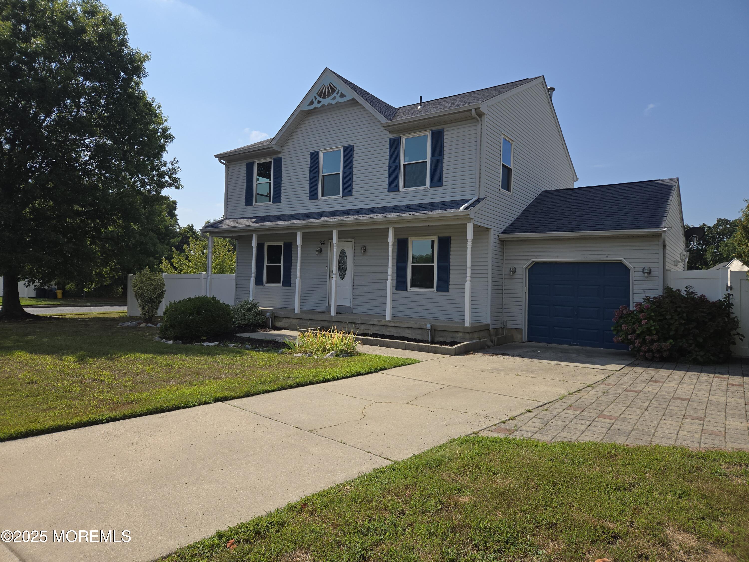 34 Vance Avenue Sicklerville, NJ 08081 - Photo 2 of 30 a front view of a house with a yard and garage